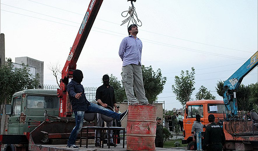 Two prisoners were hanged publicly in Iran this morning